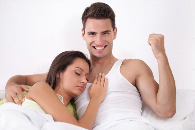 Woman in bed with a man with increased potency